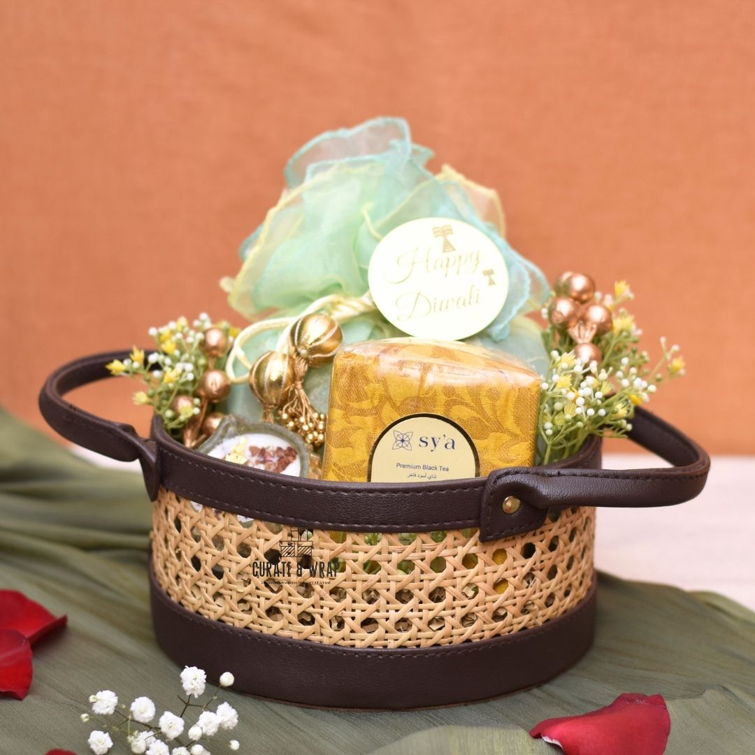 Rattan Hamper with vegan leather basket, Karak spice tea, soy wax glass diyas, and assorted nuts – Curate and Wrap Dubai
