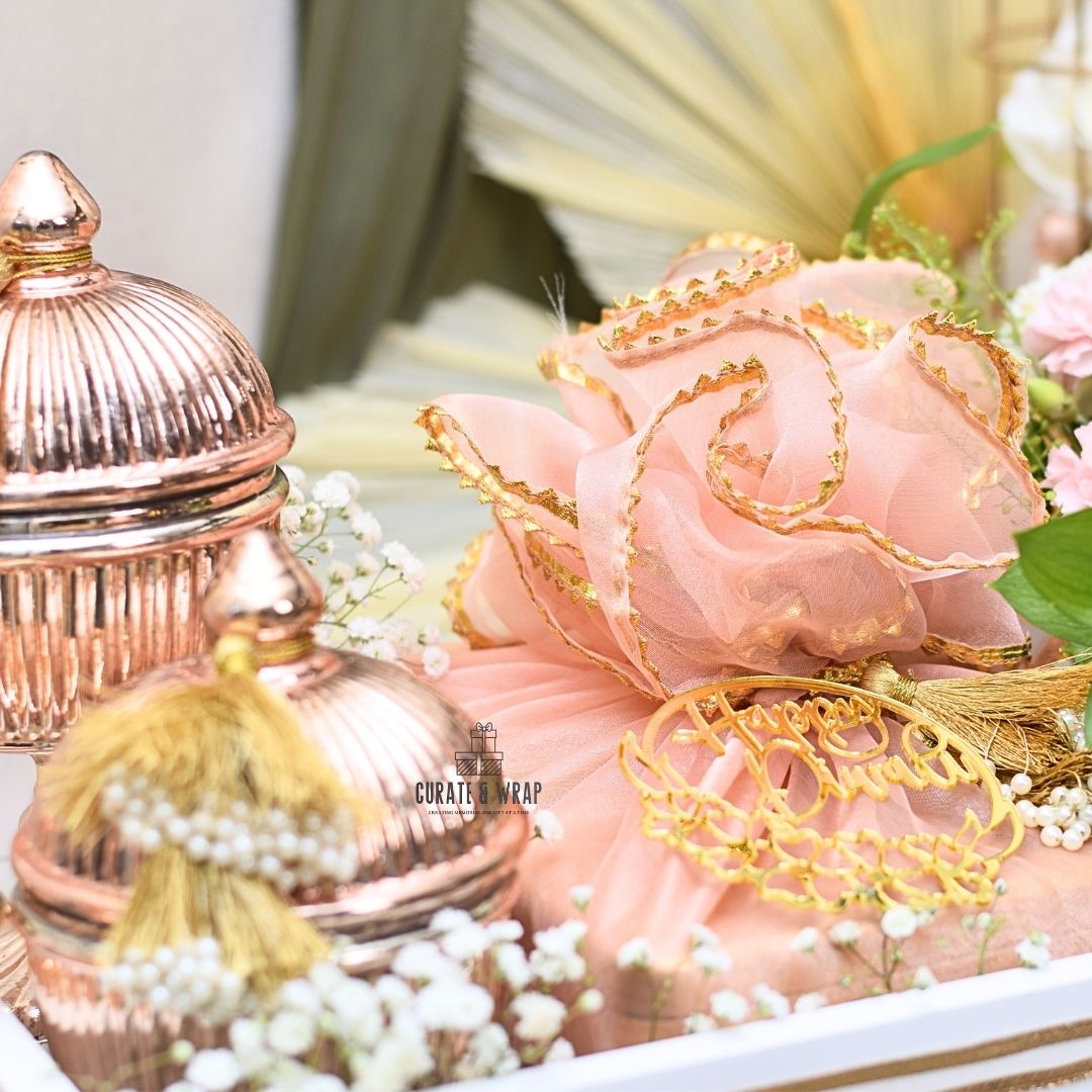 Legend Hamper with rose gold jars of gourmet nuts, premium tray, Bateel cookies, and fresh flower arrangement – luxury personal, corporate & family gift in Dubai & UAE