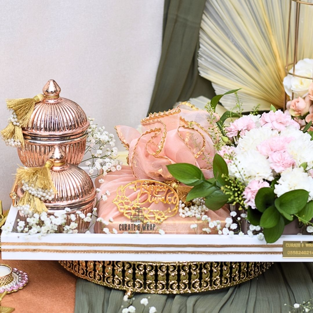 Legend Hamper with rose gold jars of gourmet nuts, premium tray, Bateel cookies, and fresh flower arrangement – luxury personal, corporate & family gift in Dubai & UAE