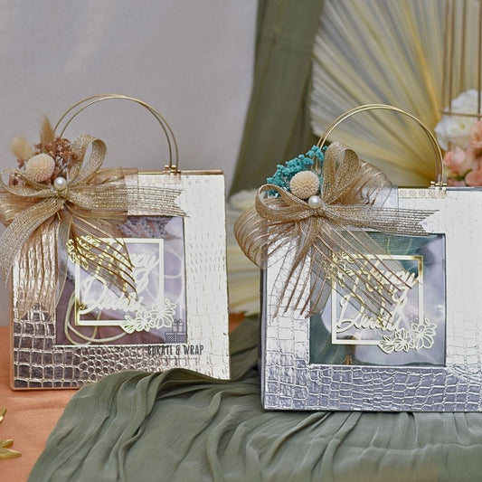 Rose Gold & Silver Bag Hampers – Leatherette Luxury Diwali Hampers with 2 Glass Jars of Gourmet Nuts Wrapped in Potlis by Curate and Wrap Dubai
