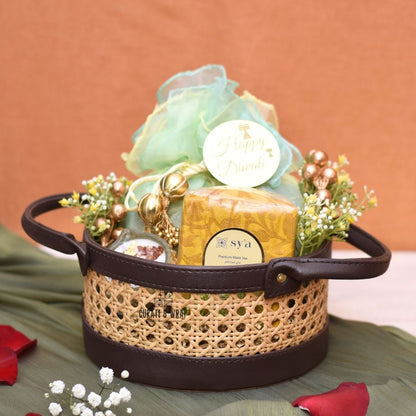 Rattan Hamper with vegan leather basket, Karak spice tea, soy wax glass diyas, and assorted nuts – Curate and Wrap Dubai