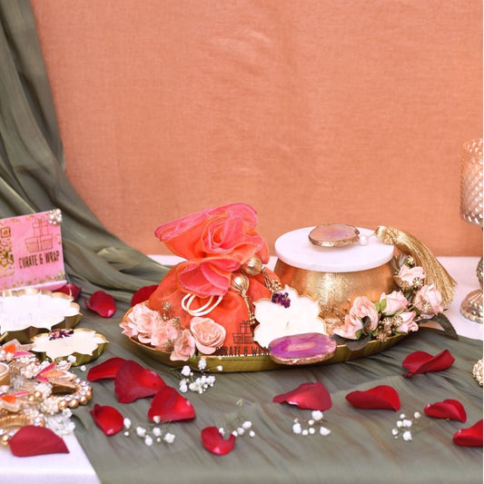 Golden Legacy Hamper with agate metal tray, marble jar of nuts, organza potli, and lotus urli soy wax candle – Curate and Wrap Dubai