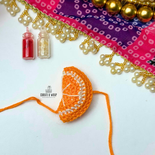 Product Code: K010 -  Orange Crochet Rakhi