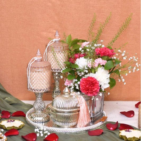 Eternal Glow Hamper with silver leatherette platter, tall glass jar candles, fresh flowers in vase, and assorted nuts – Curate and Wrap Dubai