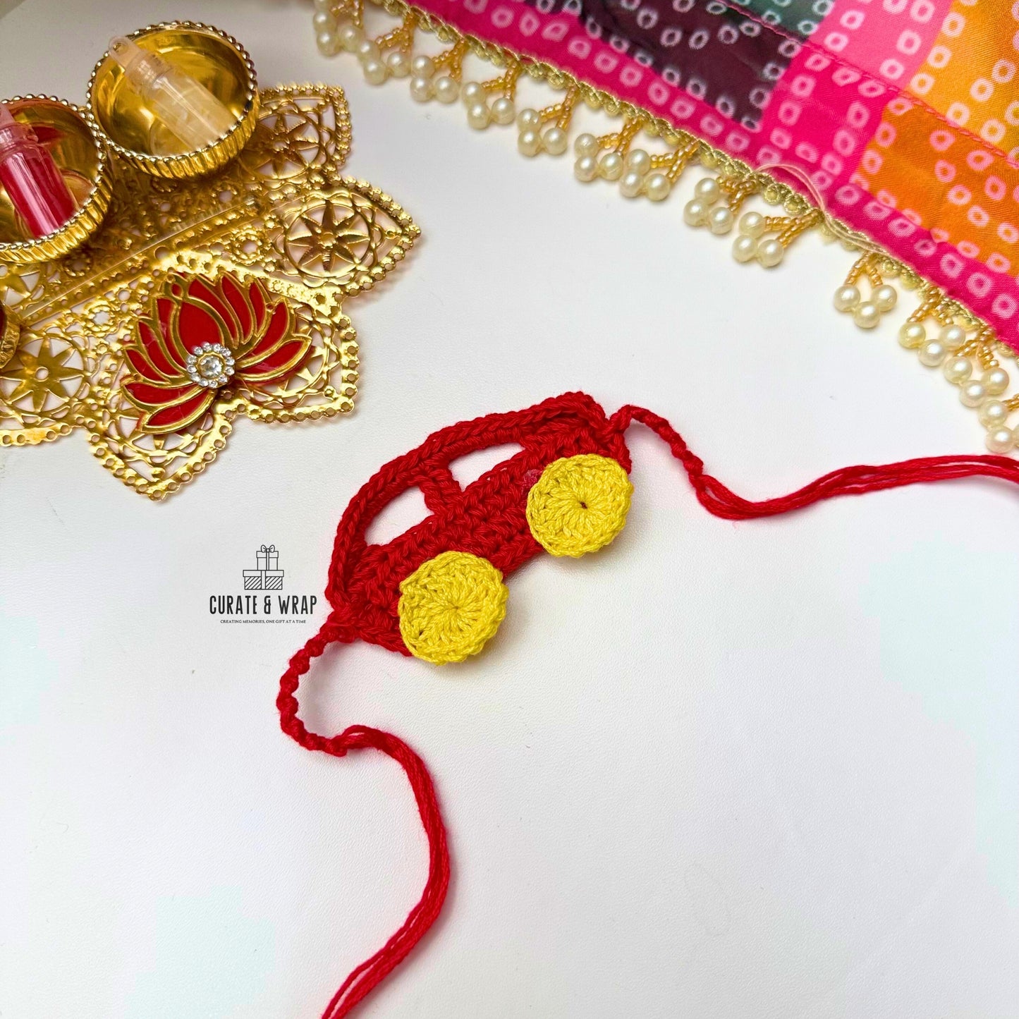 Product Code: K012-  Red Car Crochet Rakhi