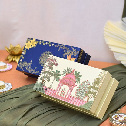 Decorative boxes with artistic designs on a textured surface