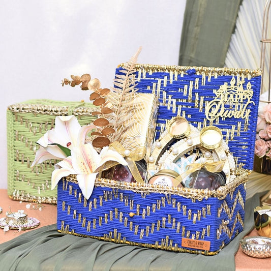 Rustic Luxe Basket in green & blue with jute woven box, assorted brownies, tea lights, gourmet nuts & Karak spice tea – luxury Diwali and corporate gift in Dubai & UAE