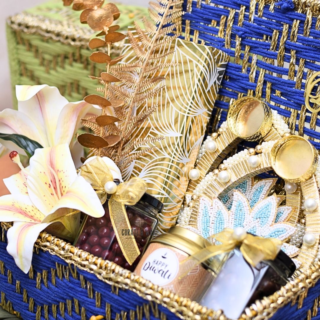 Rustic Luxe Basket in green & blue with jute woven box, assorted brownies, tea lights, gourmet nuts & Karak spice tea – luxury Diwali and corporate gift in Dubai & UAE