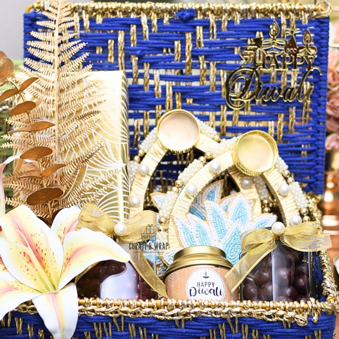 Rustic Luxe Basket in green & blue with jute woven box, assorted brownies, tea lights, gourmet nuts & Karak spice tea – luxury Diwali and corporate gift in Dubai & UAE