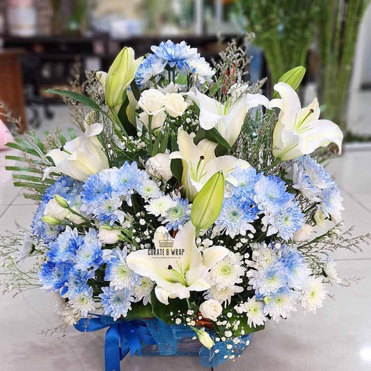 Blue Serenity premium fresh flower basket in soft blue and white tones – Curate and Wrap Dubai