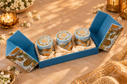Luxury blue and gold Diwali hamper with three matching tin jars in satin lining
