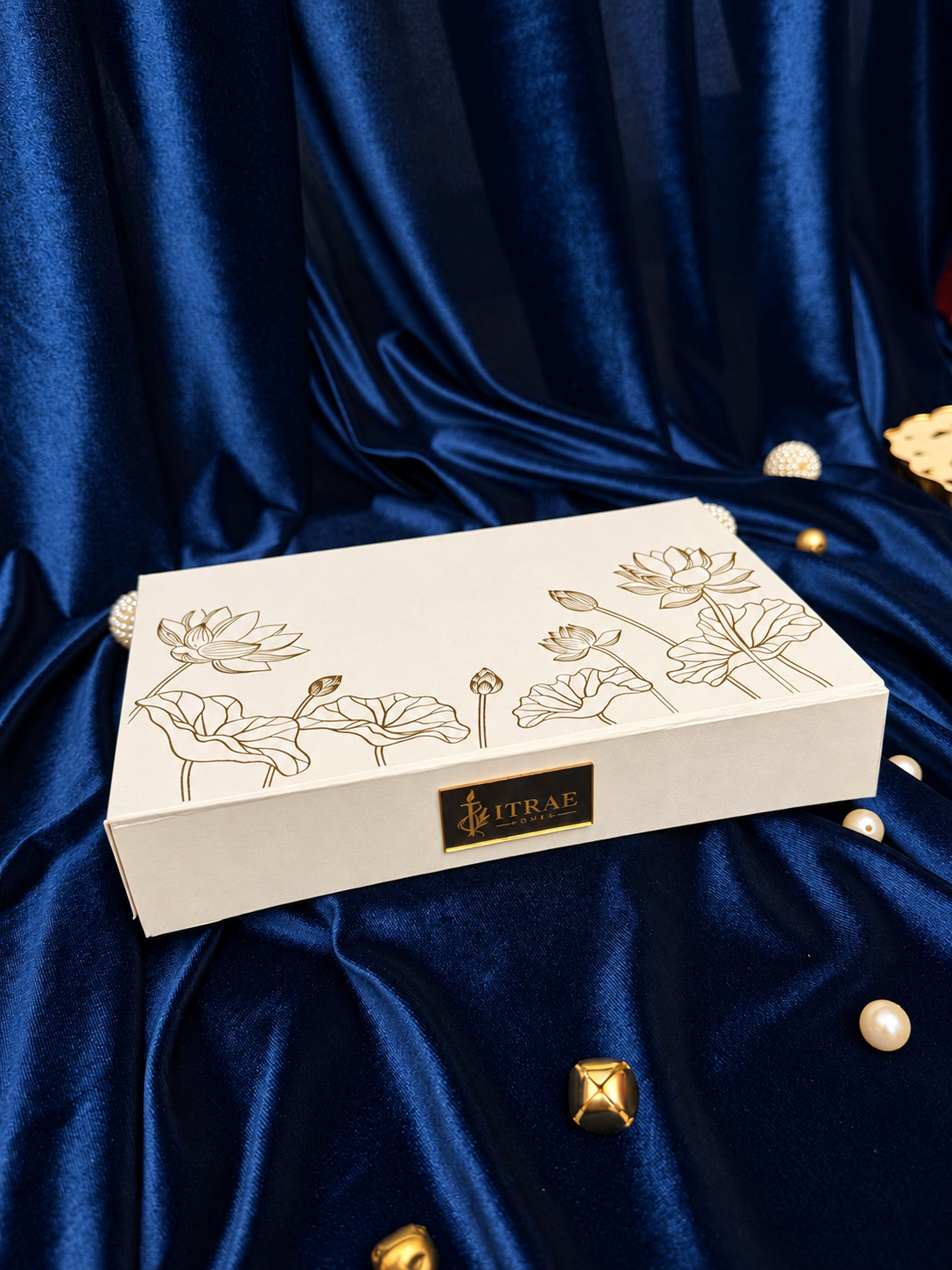 Itrae Home Shubh Lotus luxury ivory Diwali gift box with gold lotus floral artwork and gold branded plaque
 Copy