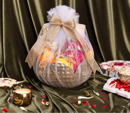 Marigold Urli Diwali hamper decorated with fresh marigold flowers and Indian sweets