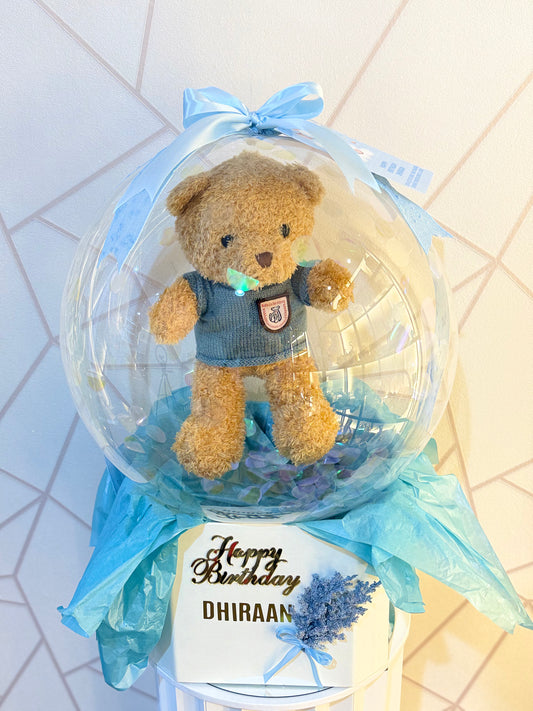 Teddy In Bobo Balloon Hamper – luxury gift hamper featuring a teddy bear encased in a transparent balloon by Curate and Wrap, Dubai