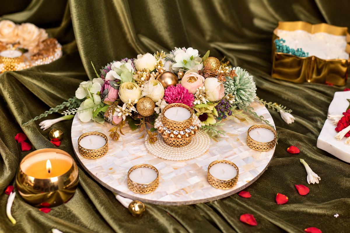 MOP table rangoli with tea lights and floral decoration for Diwali