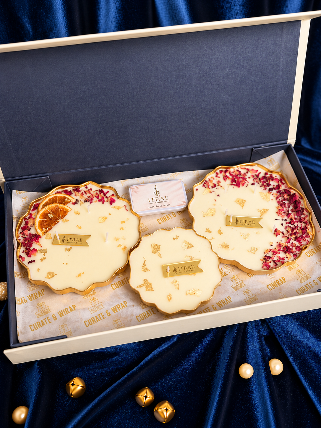 Itrae Home Padma Box featuring three gold metal Urli scented candles in 4.5-inch and 3.5-inch sizes, arranged in a luxury ivory gift box