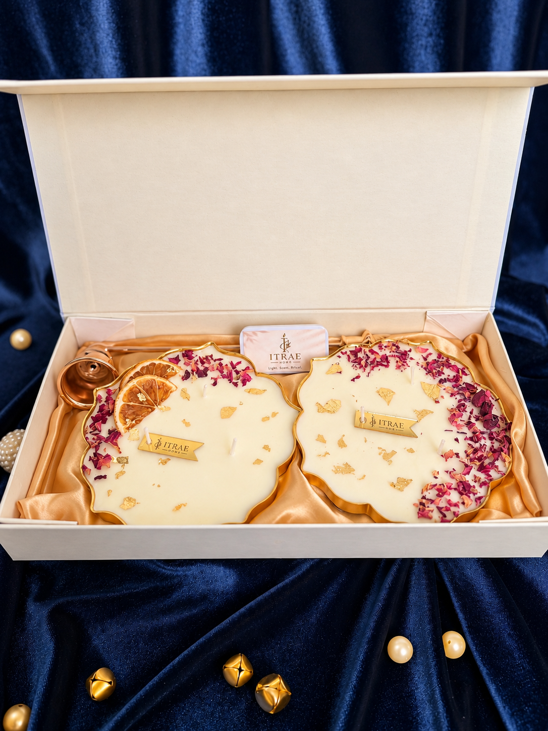 Itrae Home Dhanya Candle Box in premium ivory packaging featuring colourful garden, lotus flower and golden pavilion artwork