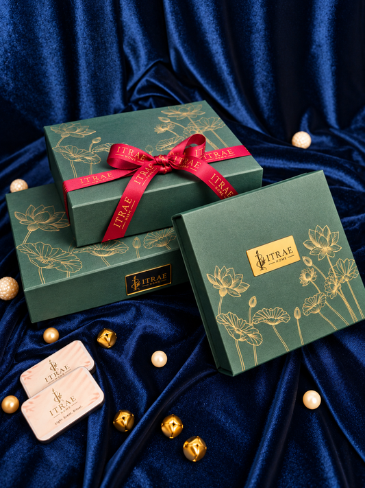 Itrae Home Samriddhi luxury green candle gift box with gold lotus floral artwork and red branded satin ribbon