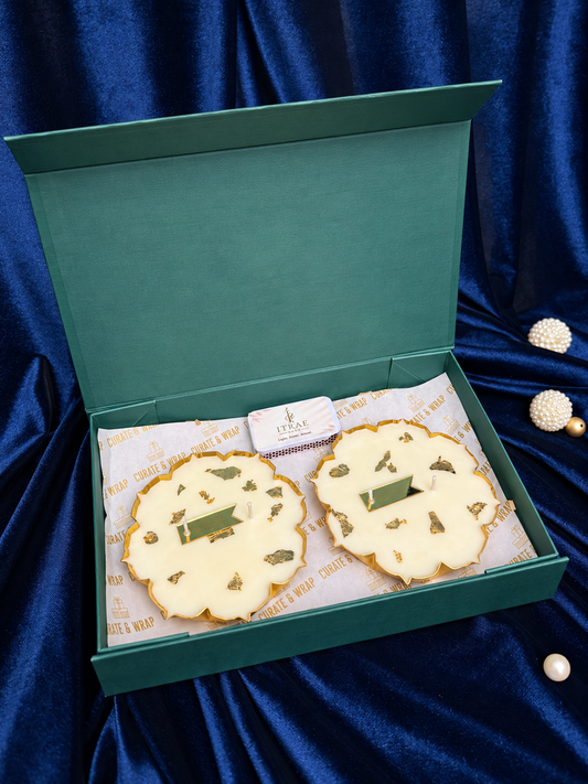 Samriddhi Box by Itrae Home featuring two gold lotus metal Urli scented candles in a premium green gift box