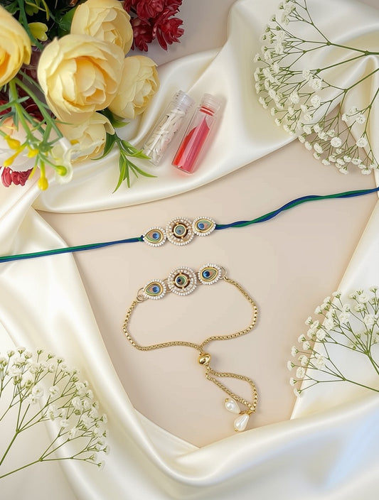 Two Indian Kalka (Kalka Garlands) laid out on a beige surface with white satin draping, flowers, and lip balm. The top kalka is teal blue with gold-plated oval motifs containing blue and green stones.