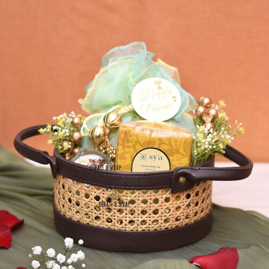 Rattan Hamper with vegan leather basket, Karak spice tea, soy wax glass diyas, and assorted nuts – Curate and Wrap Dubai